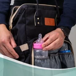 Luiertas Rugzak - Monx Luiertas Verzorgingstas Met Uitklapbaar Babybedje - Overzichtelijke Luierrugzak Extra Buggy En Kinderwagen Haken Inclusief Geïsoleerde Flessenhouder - Zwart -Winkel voor babyproducten 1200x1200 1733